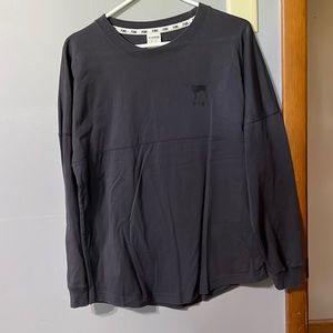 Long sleeve tunic from Pink. Dark gray with cheetah print lettering.